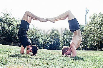 Similar – Image, Stock Photo Two young gymnast girls showing their flexibilty and stretching posing outdoor on a summer day