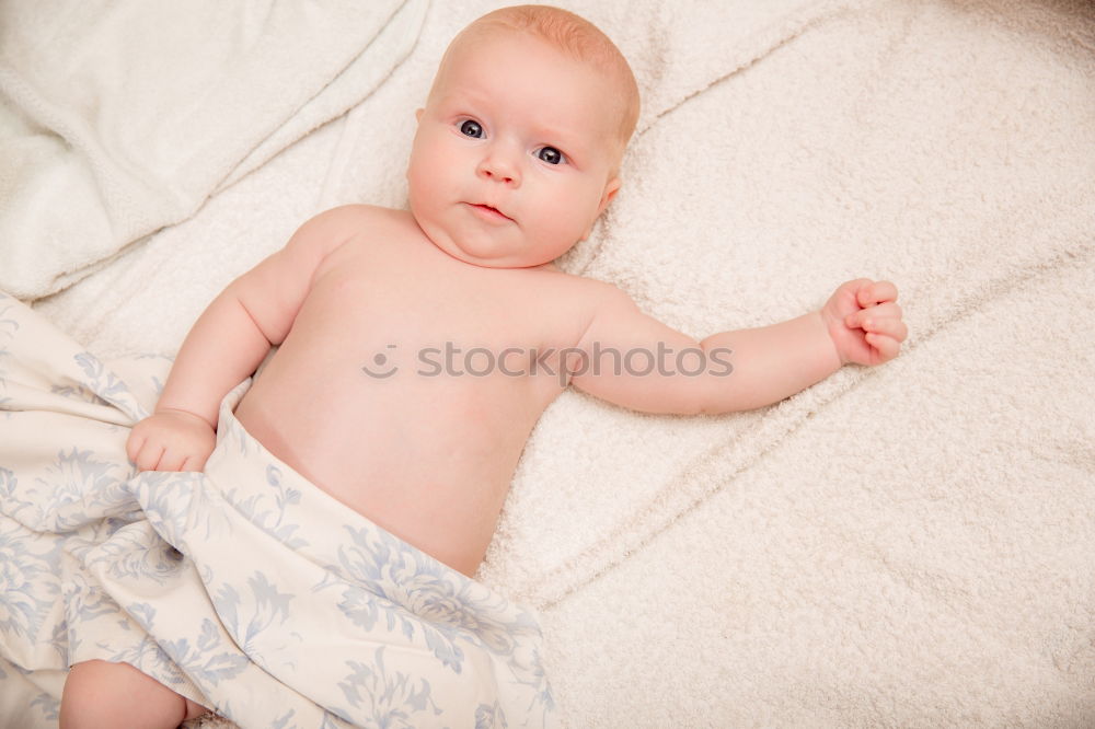 Similar – Portrait of a crawling baby on the bed in his room