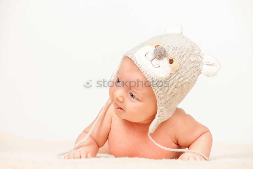 Similar – Baby girl in a bed with toys around.