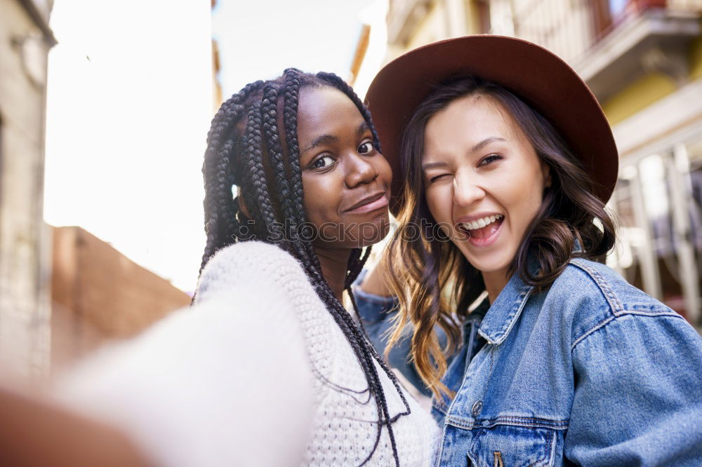 Beautiful women having fun in the street.