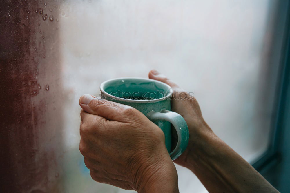 Similar – Image, Stock Photo Turquoise coffee mug held by hands of young woman in yellow pigtail sweater