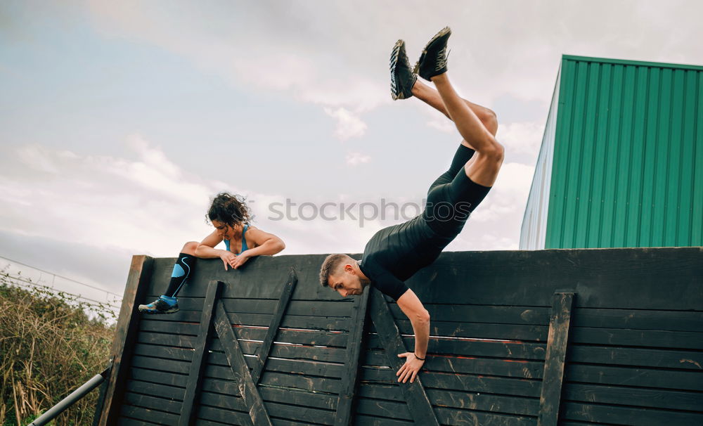 Man in obstacle course doing irish table