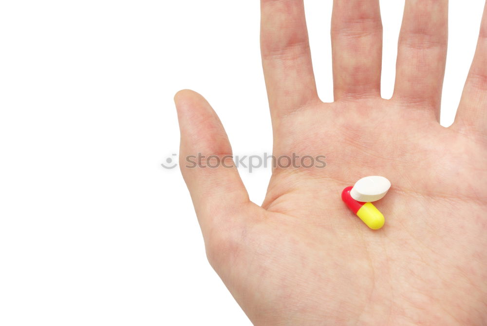 Similar – Hand and various pills on it. Human skin and medicines.