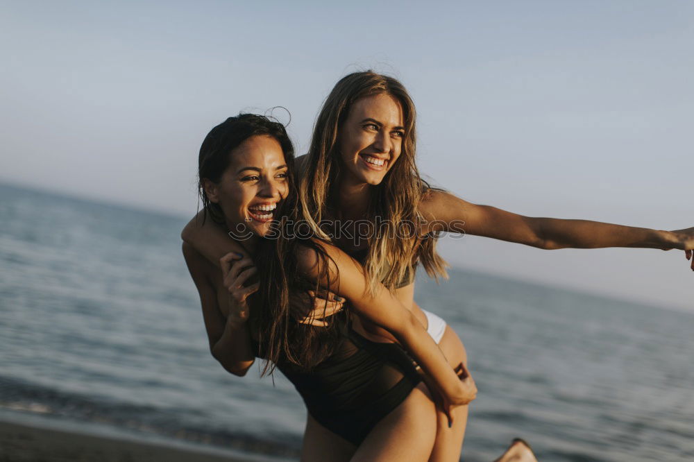 Similar – Group of best friends cheerful on the beach in sunset