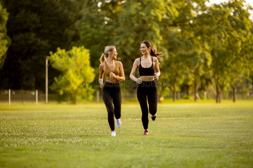 Similar – Healthy Woman Jogging in the Park with her Dog