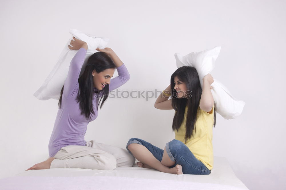 Similar – happy mother and child son playing pillow fight