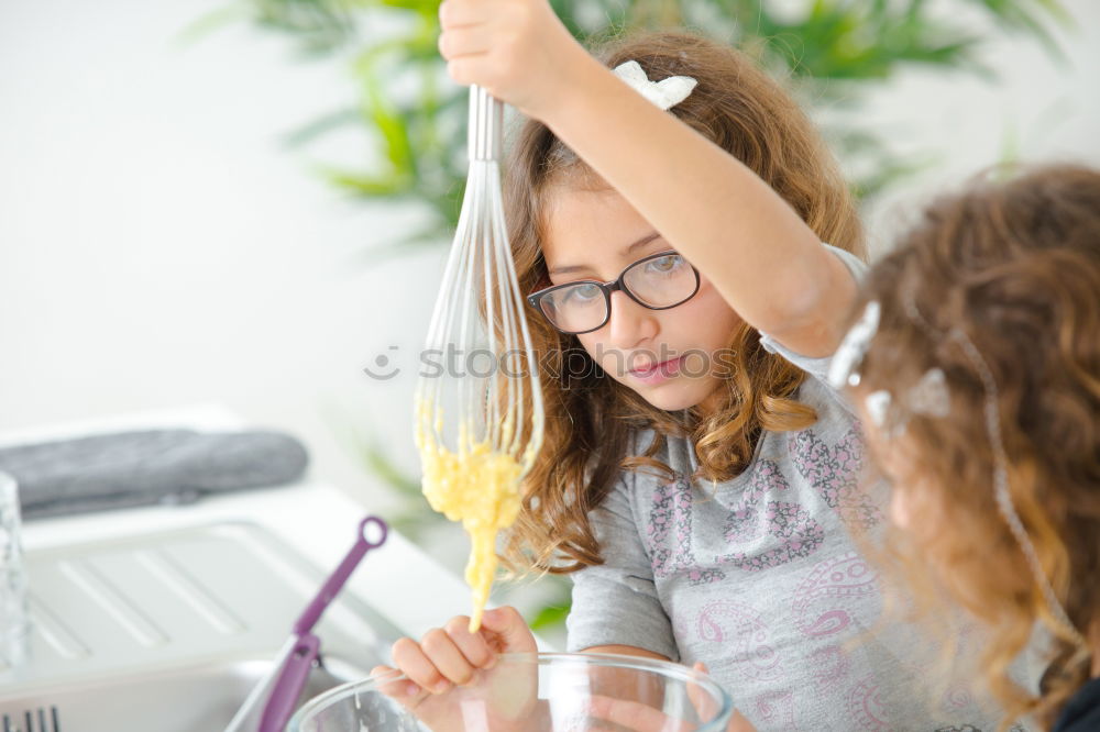 Similar – Image, Stock Photo Little sisters girl preparing baking cookies.