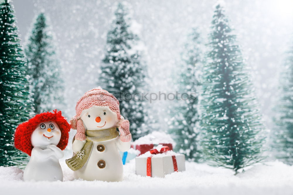 Similar – Mother is playing with her little daughter outdoors on wintery day. Woman is throwing snow on her child. Family spending time together enjoying wintertime. Woman is wearing red coat and wool cap, toddler is wearing dark blue snowsuit