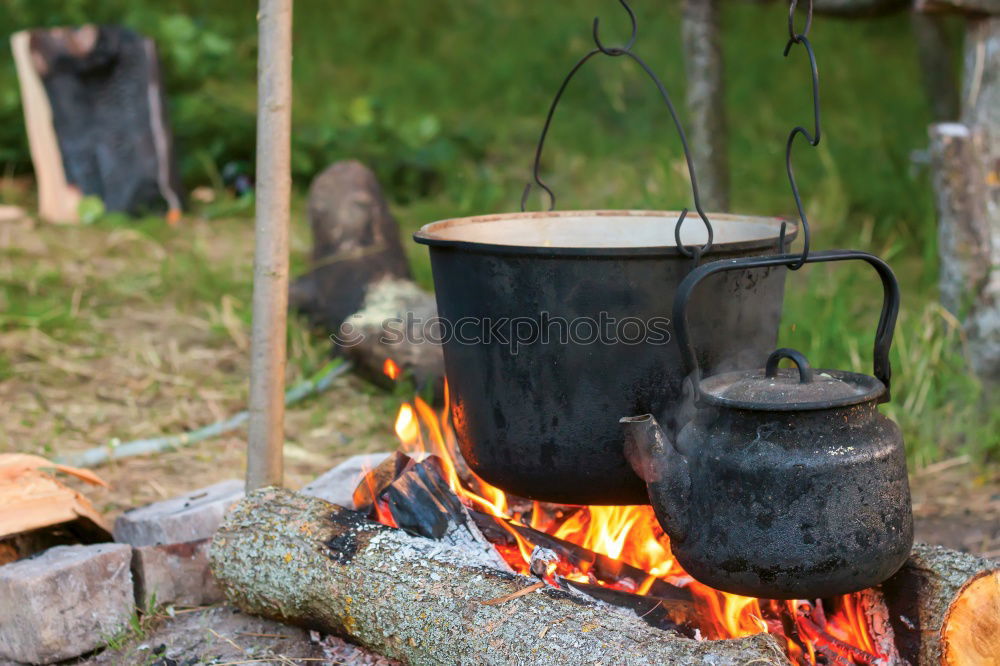 Similar – Making coffee on campfire