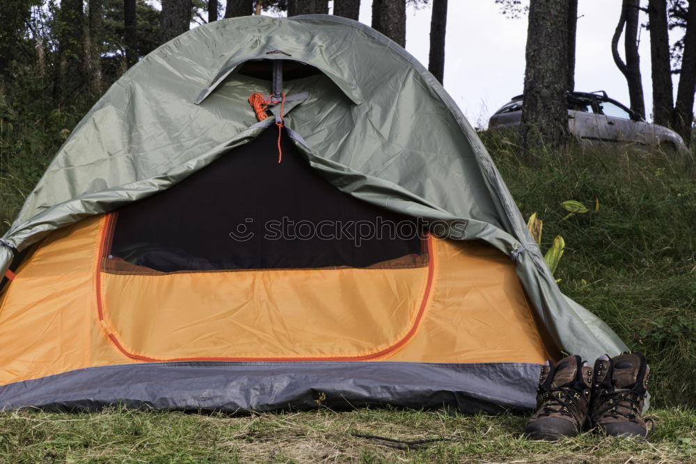 Similar – Orange tent in a pine forest