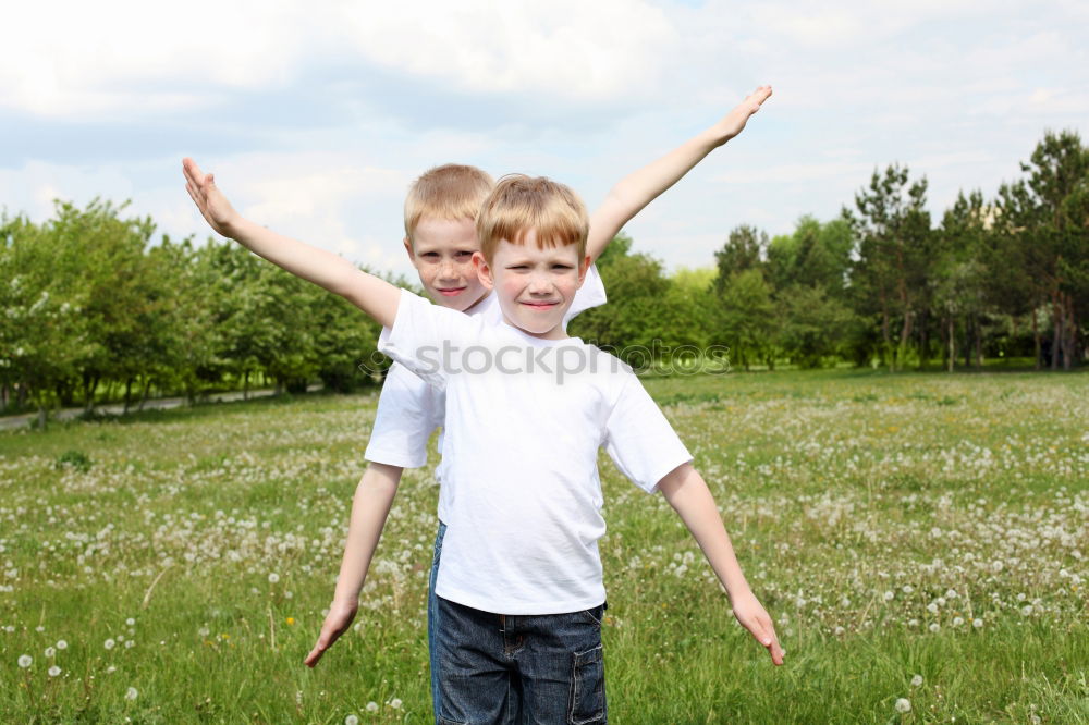 Similar – Image, Stock Photo Mother and son playing on the beach at the day time.