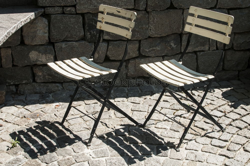 Similar – metallic chairs on the street