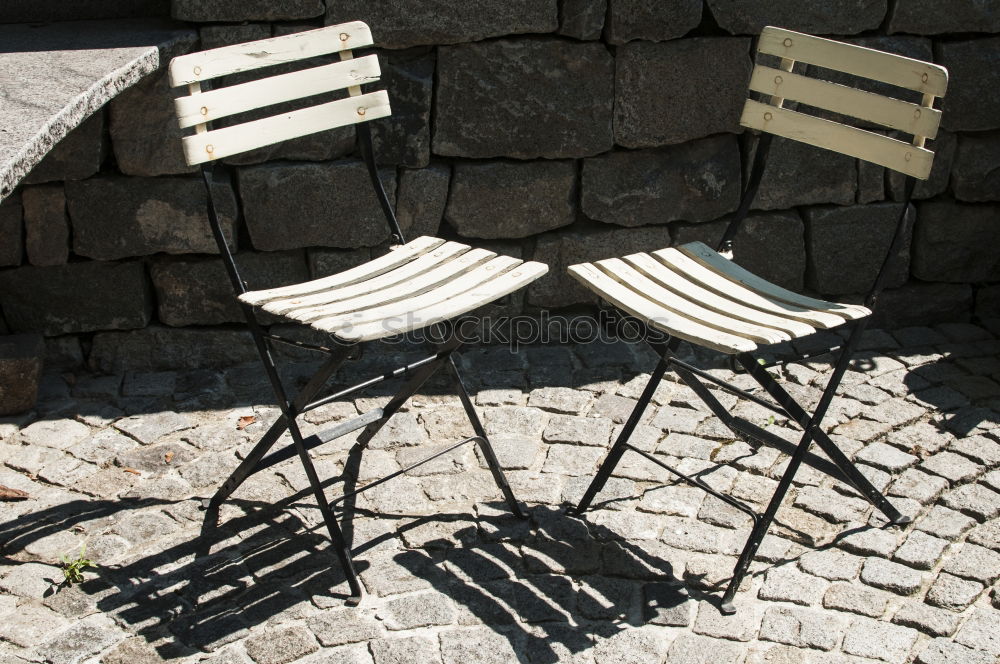 Similar – metallic chairs on the street