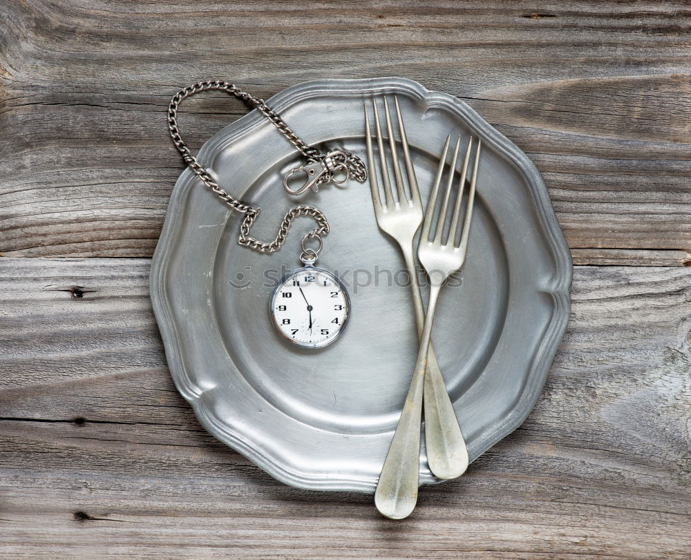 Similar – Spoon and fork on the plate framed with spices