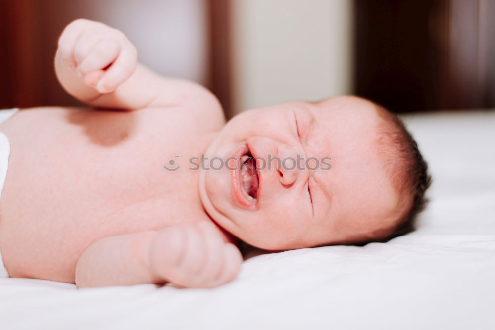 Similar – Image, Stock Photo Closeup shot of newborn baby lying on mother’s hand.