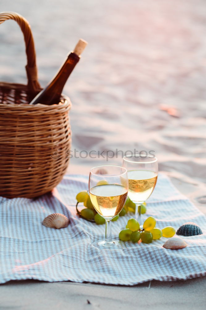 Similar – Image, Stock Photo Two wine glasses, wicker basket on beach