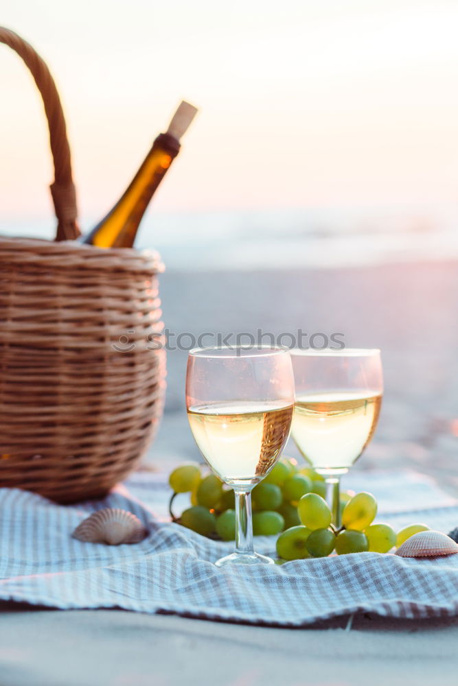 Similar – Image, Stock Photo Two wine glasses, wicker basket on beach