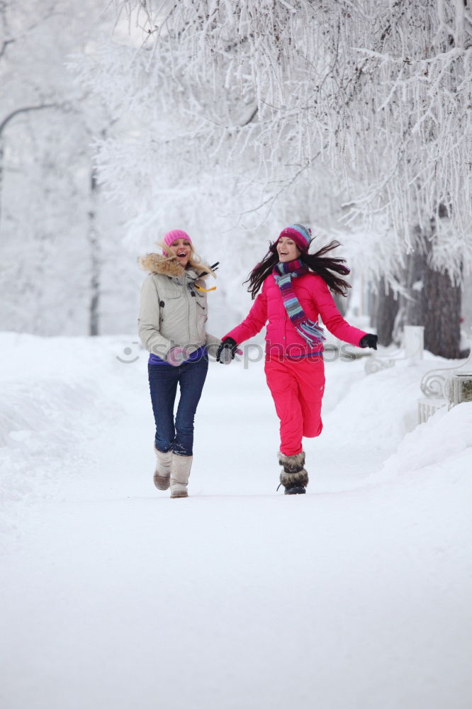 Similar – Mother enjoying the snow with her daughter outdoors