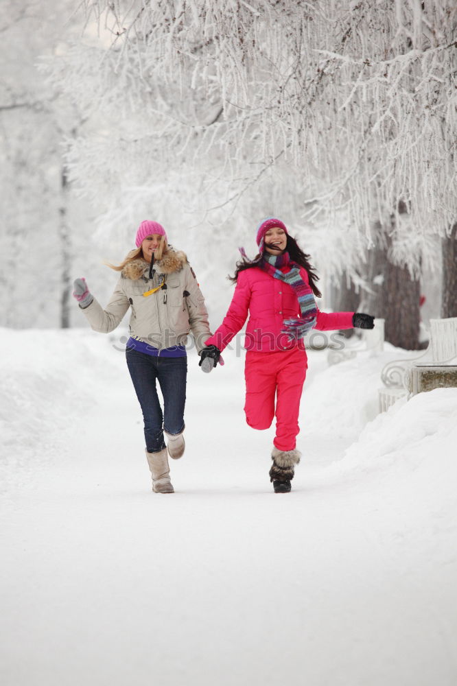 Similar – Mother enjoying the snow with her daughter outdoors