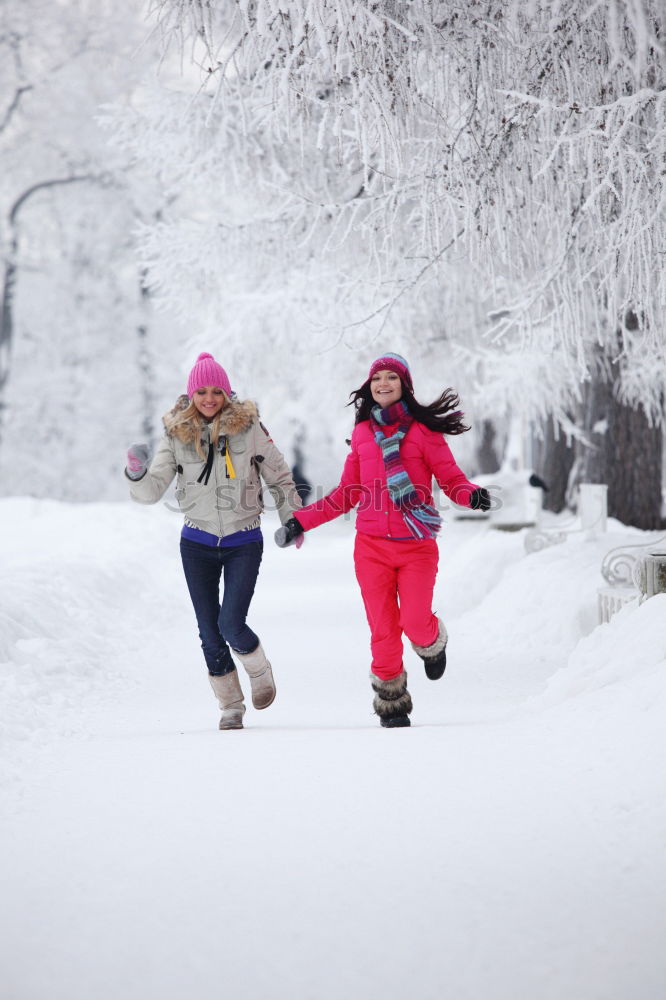 Similar – Mother enjoying the snow with her daughter outdoors