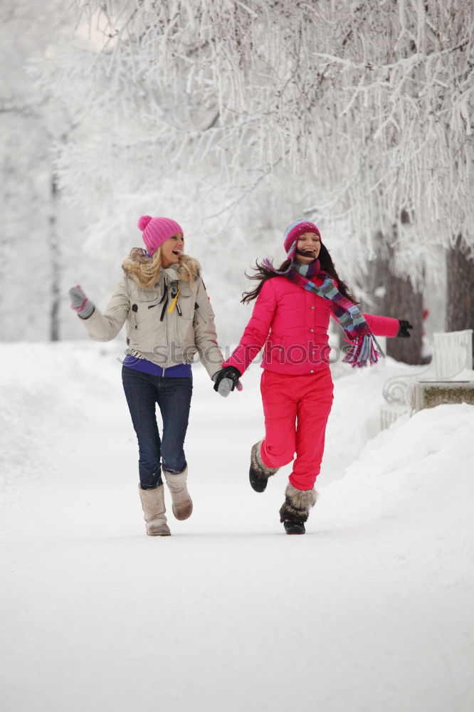 Similar – Mother enjoying the snow with her daughter outdoors