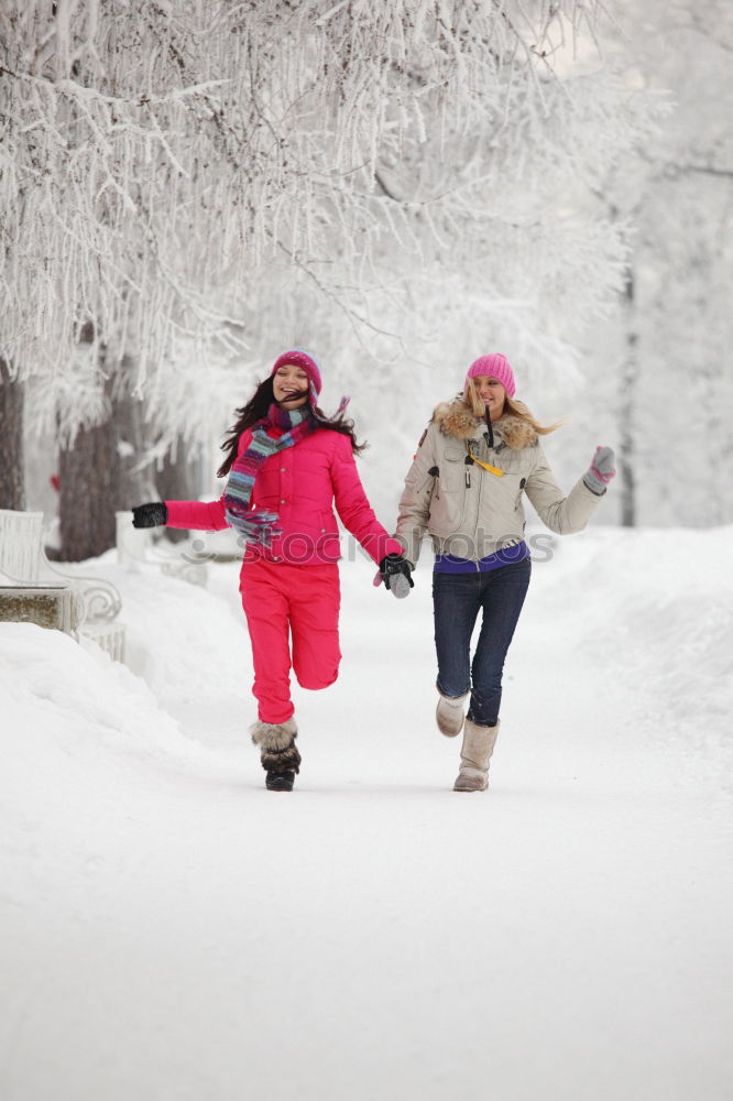 Similar – Mother enjoying the snow with her daughter outdoors