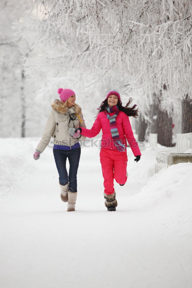 Similar – Mother enjoying the snow with her daughter outdoors