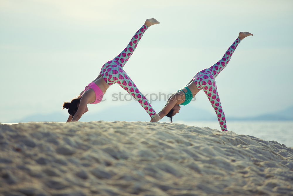 Similar – Two girls on the beach doing yoga at sunset. Lima Peru.