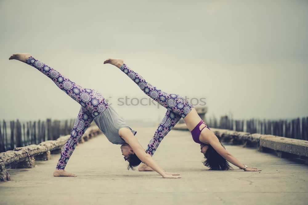 Similar – Two girls on the beach doing yoga at sunset. Lima Peru.