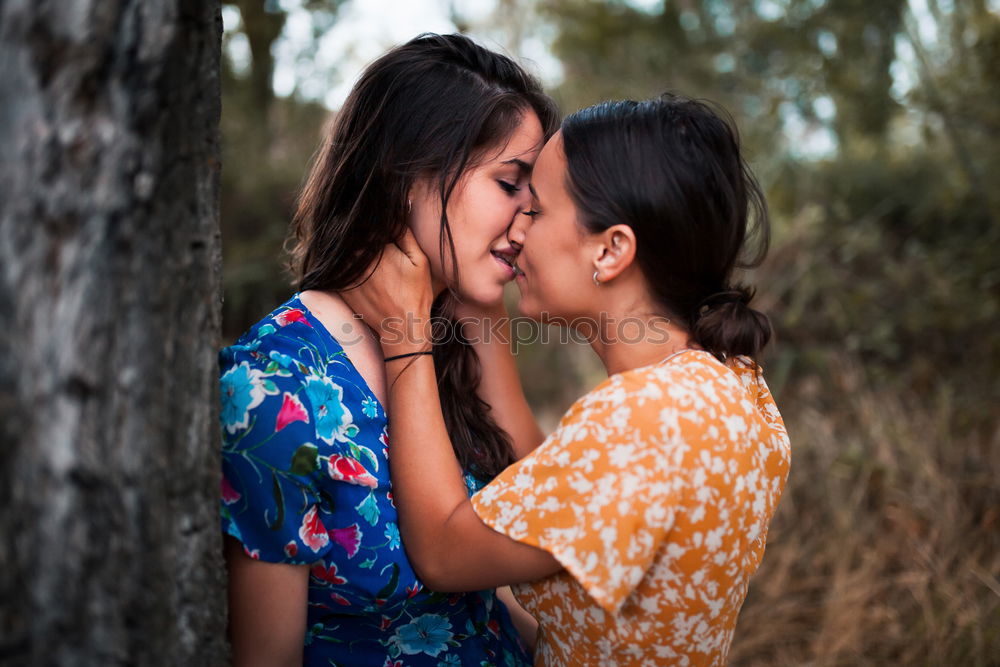 Image, Stock Photo Happy mother kissing her daughter enjoying a winter afternoon