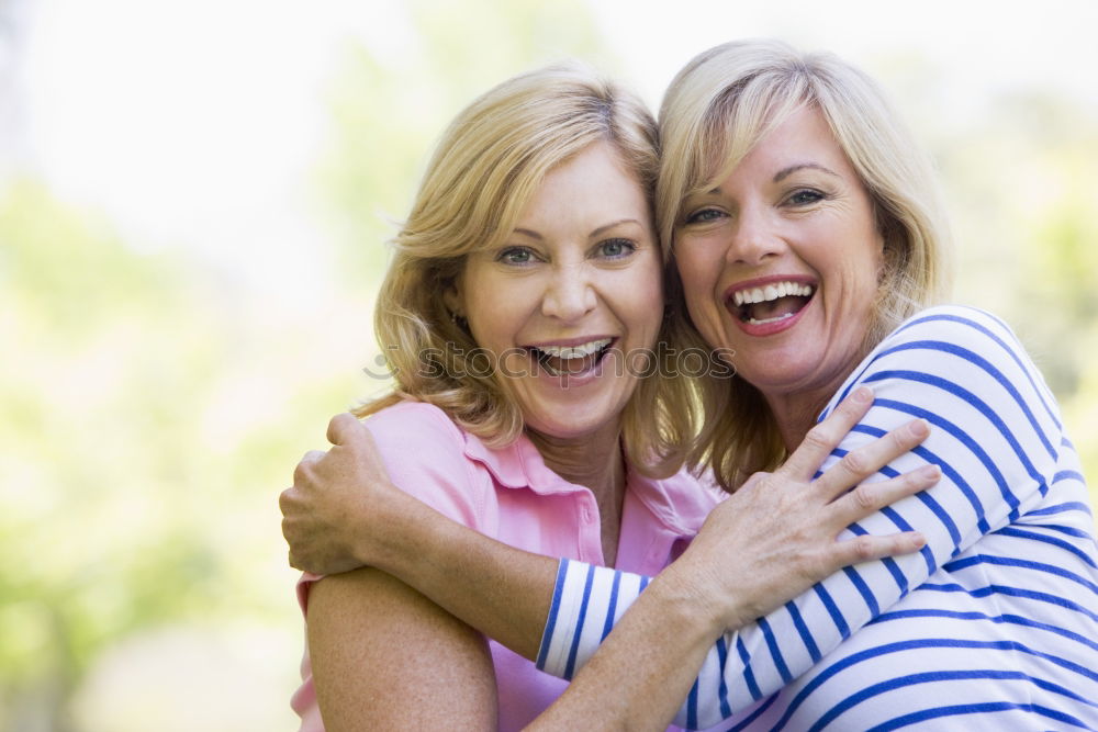 Similar – Two happy girls hugging in urban park.