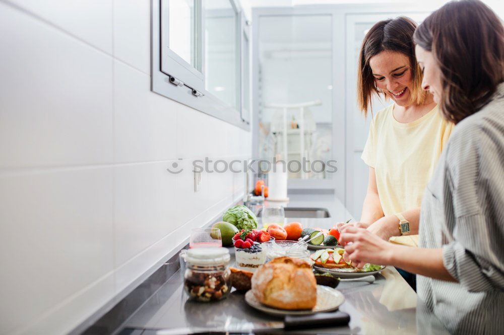 Similar – Woman preparing sandwiches in kitchen