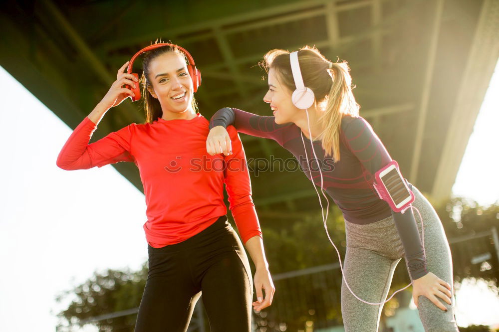 Similar – Young fitnesswoman runner stretching legs after run.