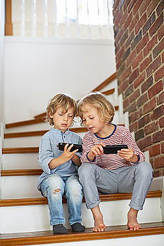 Similar – Portrait of two happy children sitting on the stairs