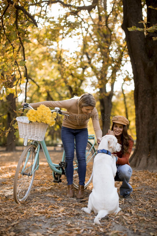 Similar – young beautiful woman having fun with her dog outdoors