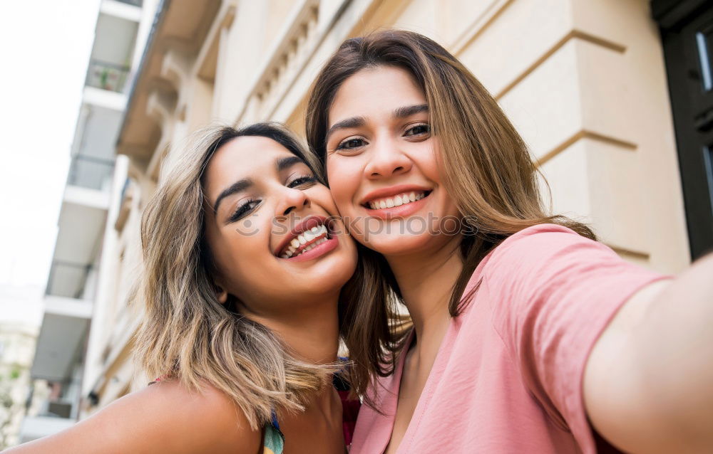 Similar – Beautiful women taking a selfie portrait in park.