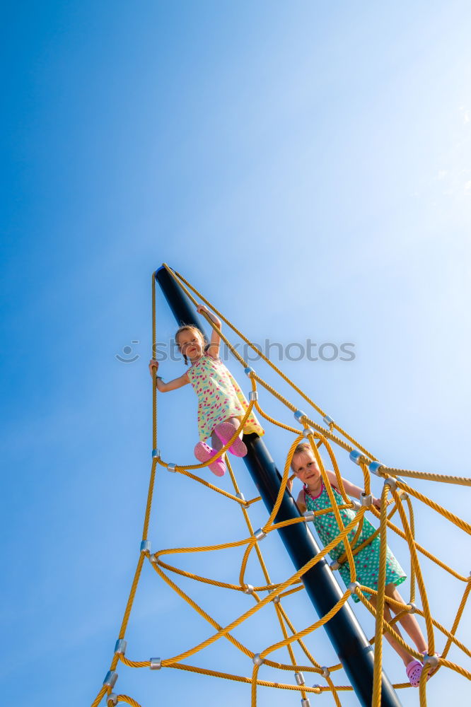 Similar – Woman with afro hair climbing by children’s attractions.