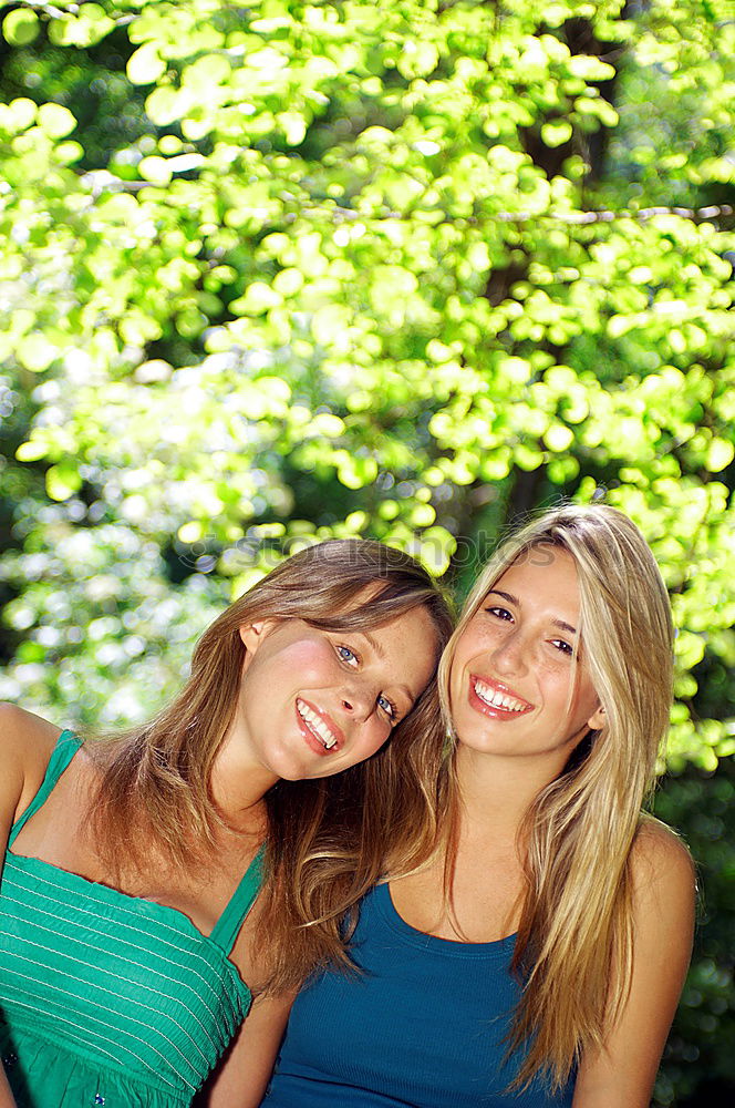 Similar – Two happy girls hugging in urban park.