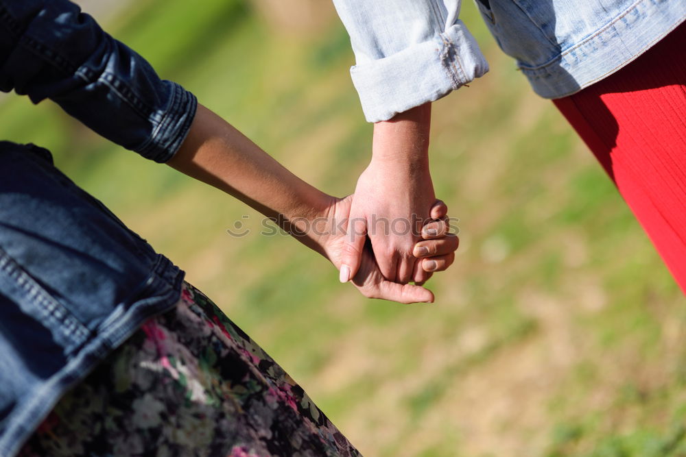 Similar – Two young women in walking holding her hands