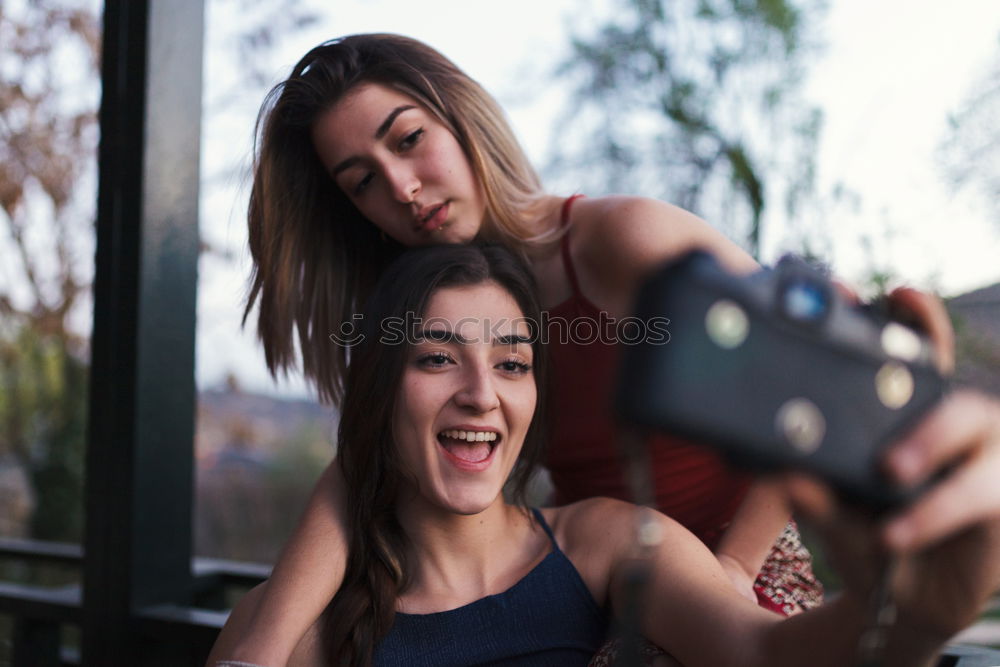 Similar – Image, Stock Photo Young adult hipster girlfriends taking selfie and pulling faces