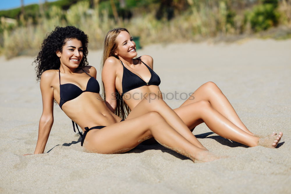 Similar – Two young women in swimsuit on a tropical beach