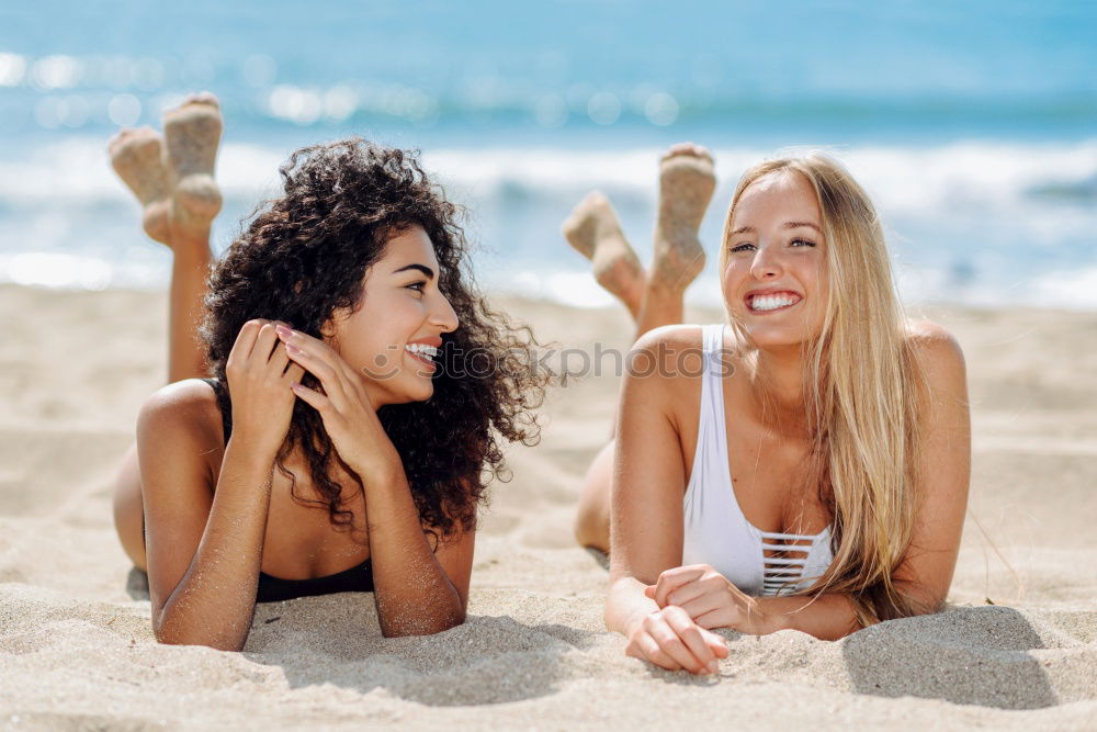 Similar – Image, Stock Photo Two women on the sand of a tropical beach