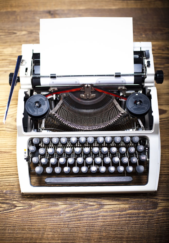 Similar – vintage photography still life with typewriter, folding camera, globe map and book on a wood table.