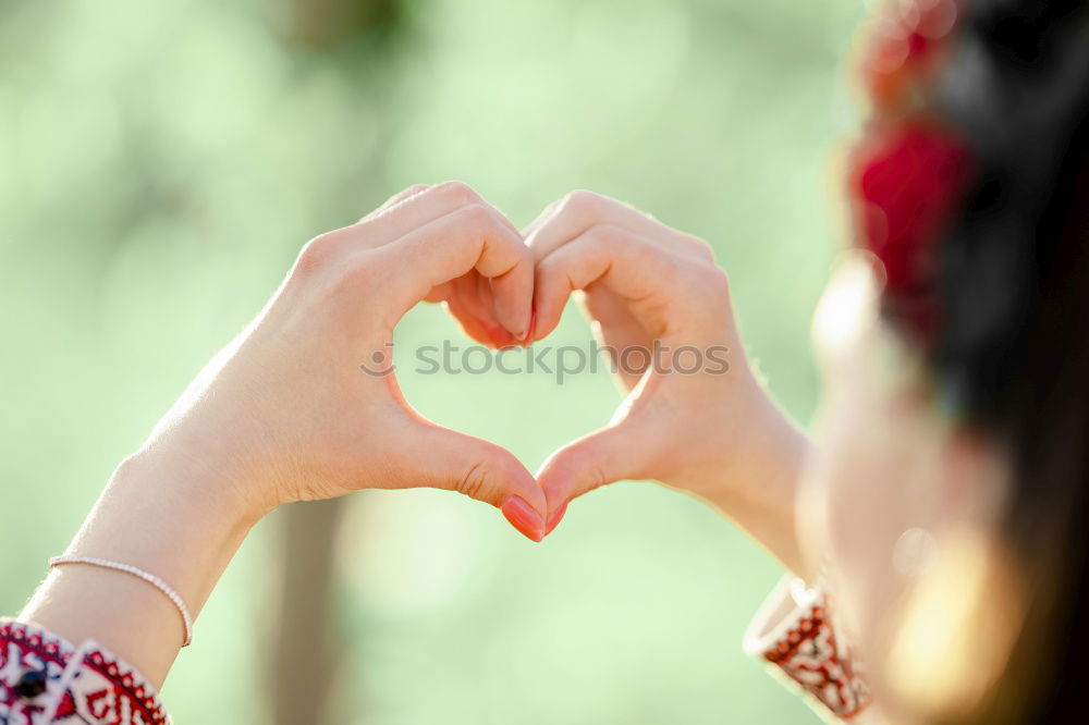 Image, Stock Photo Woman gesturing heart on street