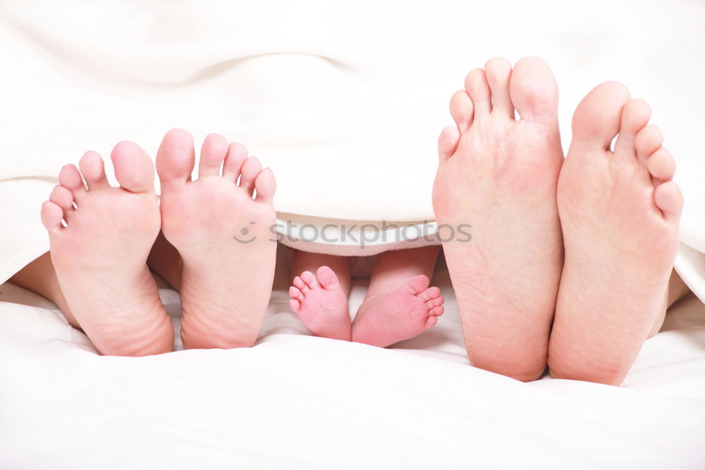 Similar – Happy children sitting on the bed barefoot.