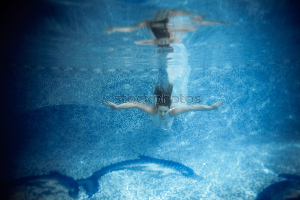 Similar – Image, Stock Photo Young woman diving in the sea