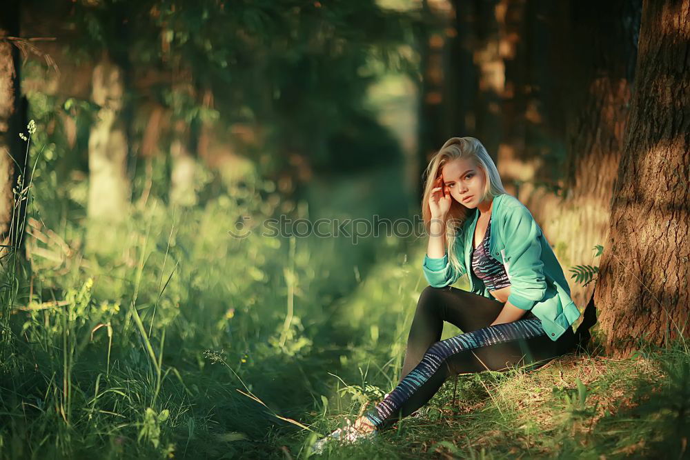 Similar – Image, Stock Photo Young woman sitting in a green rural path