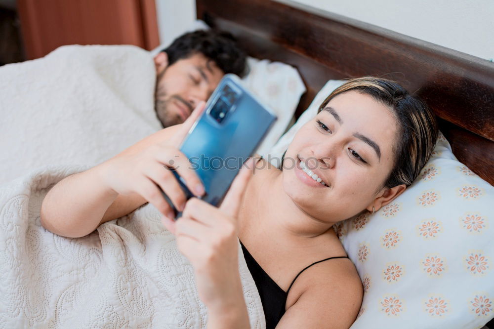 Image, Stock Photo Young couple reading book on couch at home