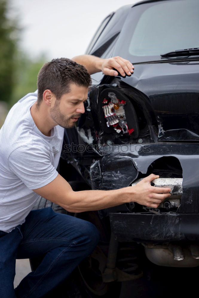 Similar – young guy repairing an old car