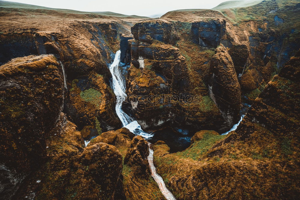 Similar – River flowing in mountains